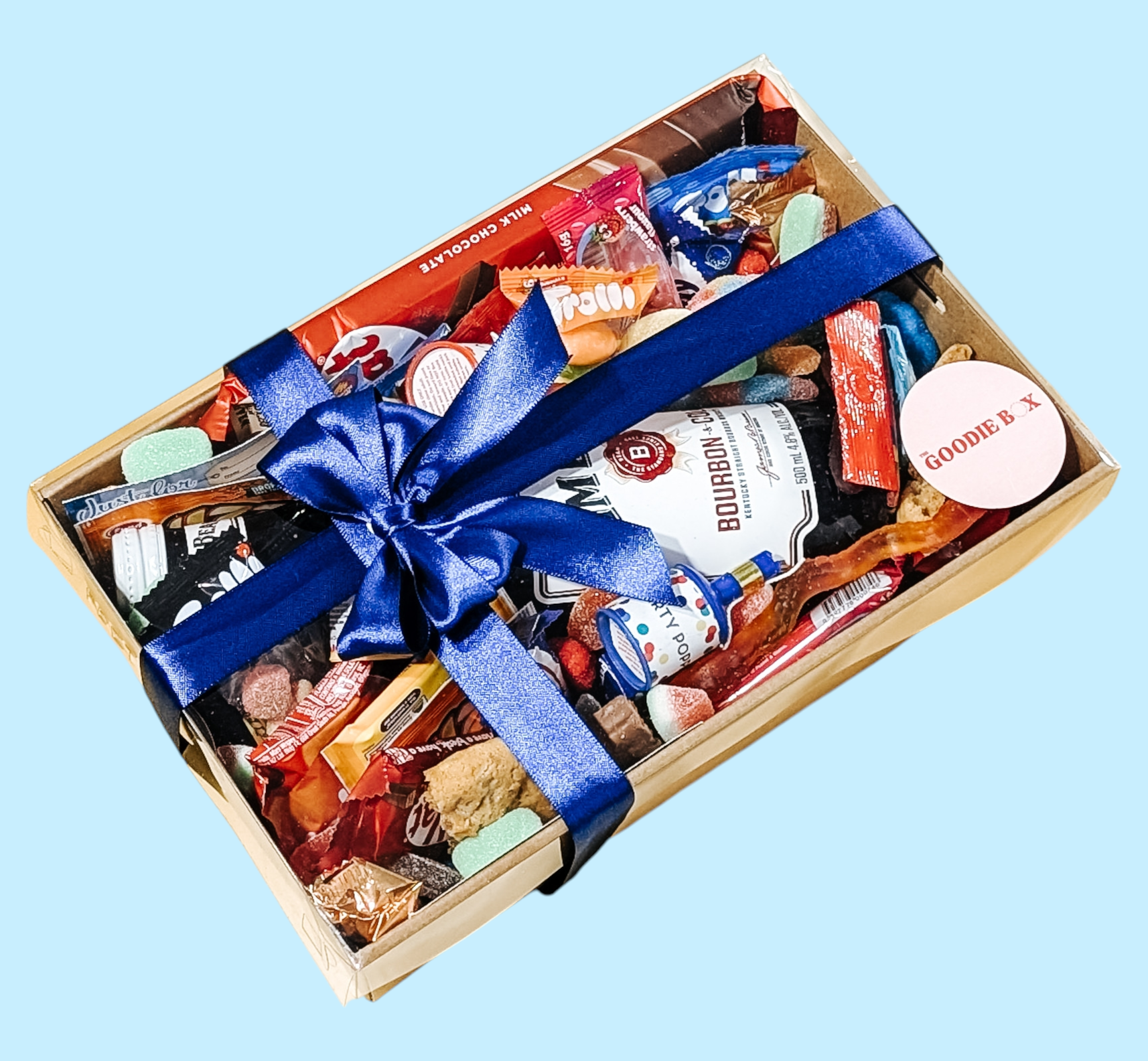 Photograph of male gift hamper that is neatly wrapped with a blue satin bow.