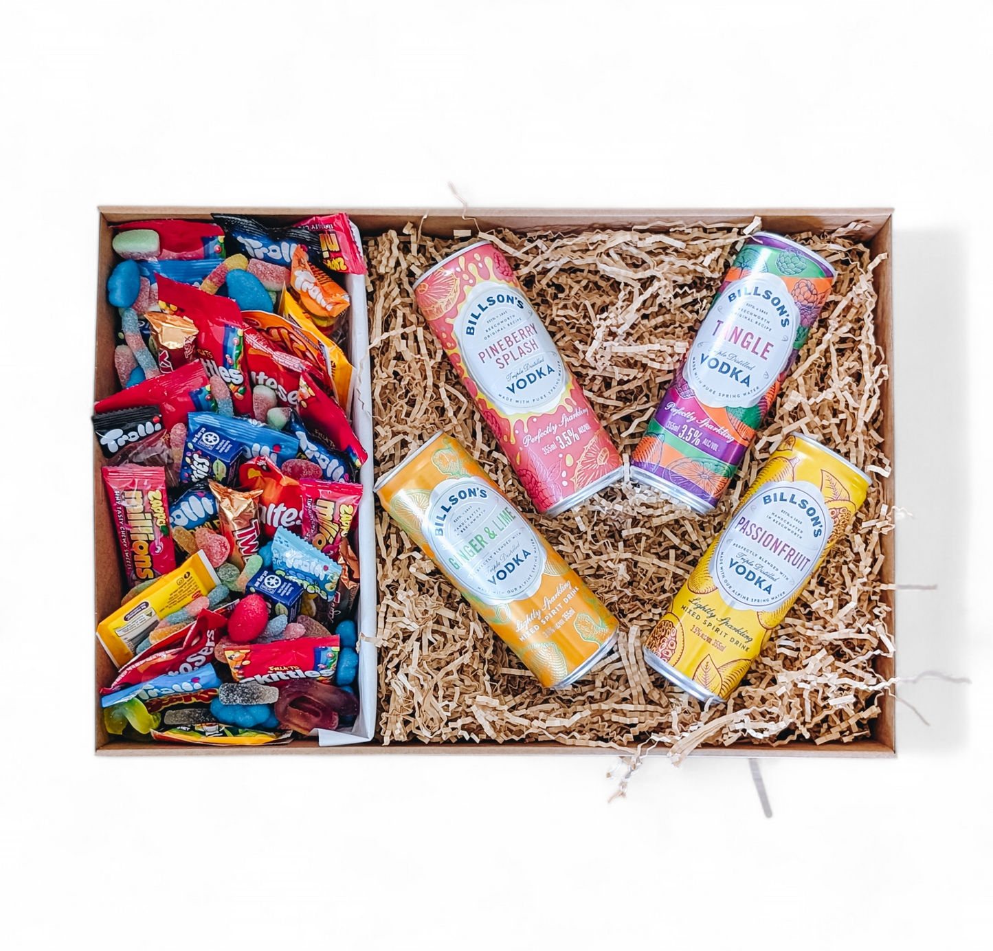 Photograph of gift hamper featuring four cans of Billson's vodka mix and a mixture of sweets and lollies.