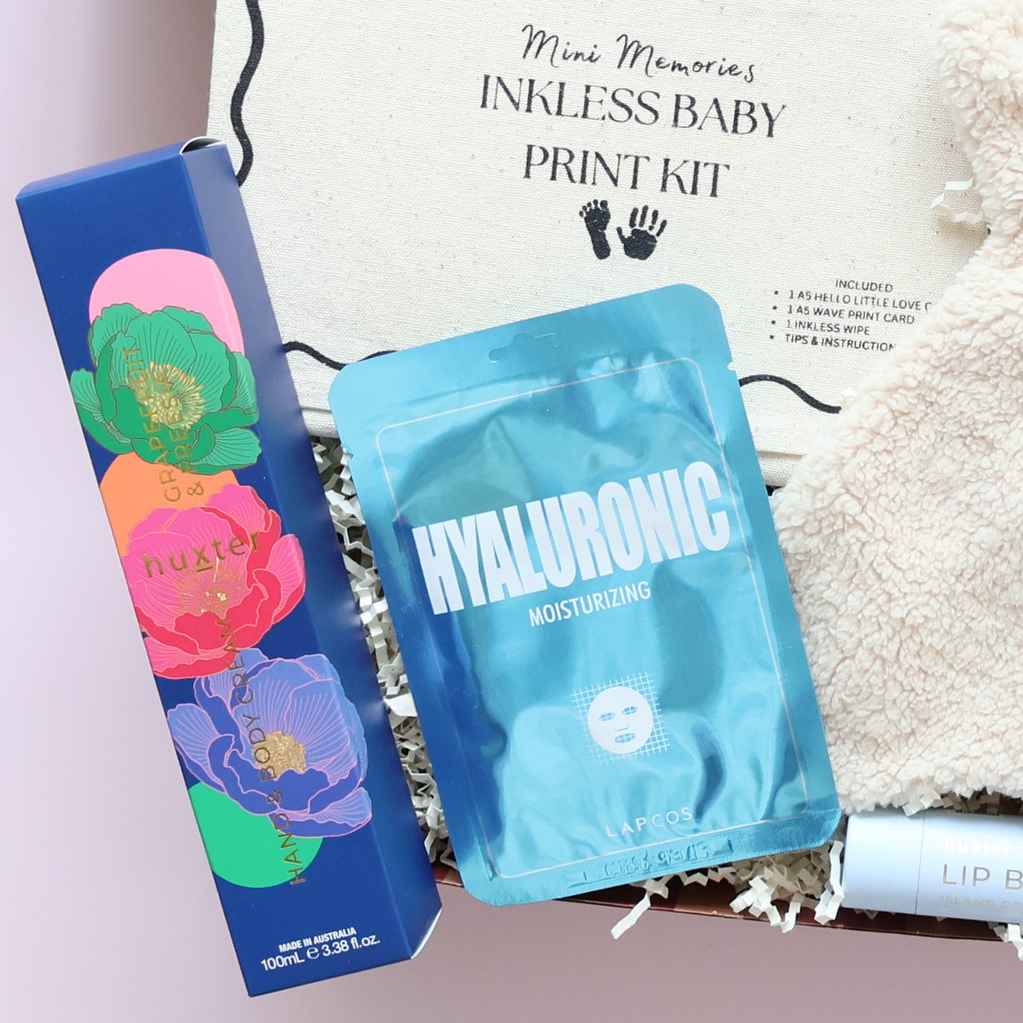New baby boy gift box featuring Huxter body cream and Lapcos Hyaluronic Moisturising K-beauty face mask