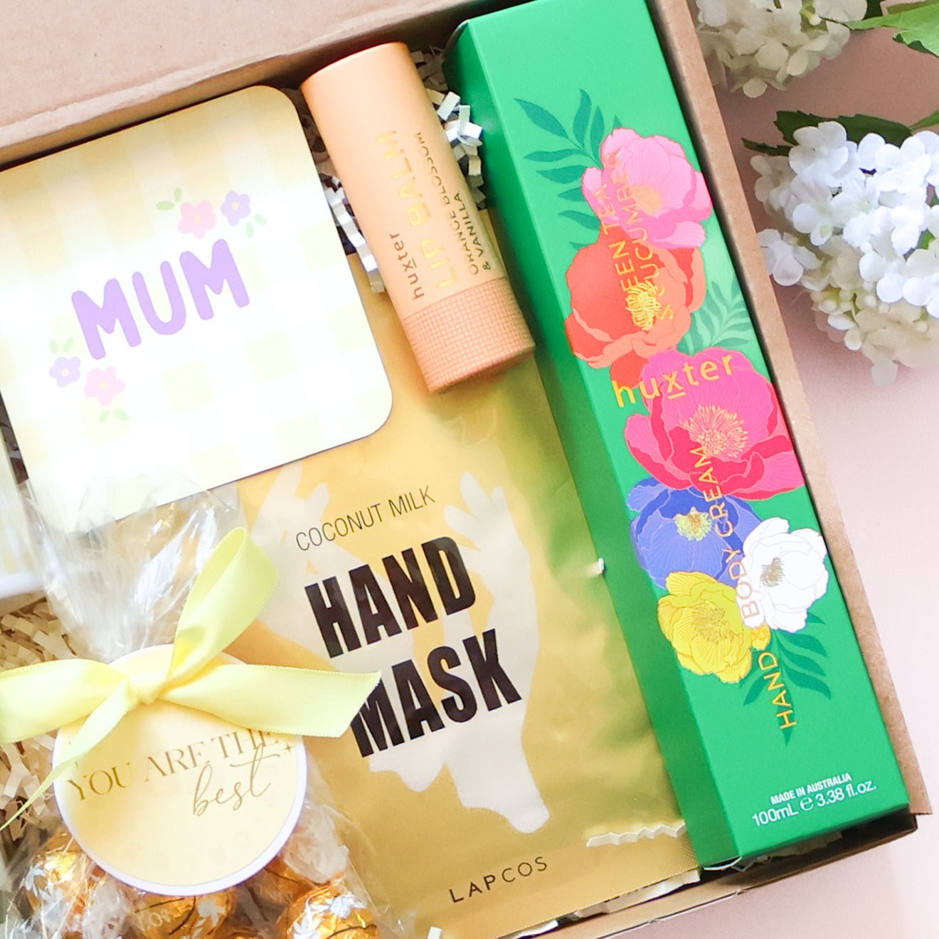 MUM gingham coaster, Lapcos coconut milk hand mask, Huxter lip balm and Huxter hand and body cream detail — personalised Mother's Day hamper Perth by The Goodie Box