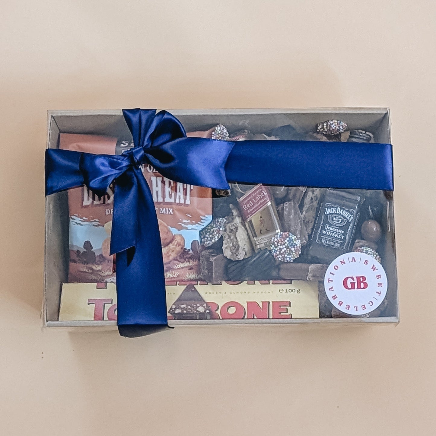 Fathers dat gift set with a blue ribbon in a box on a beige background
