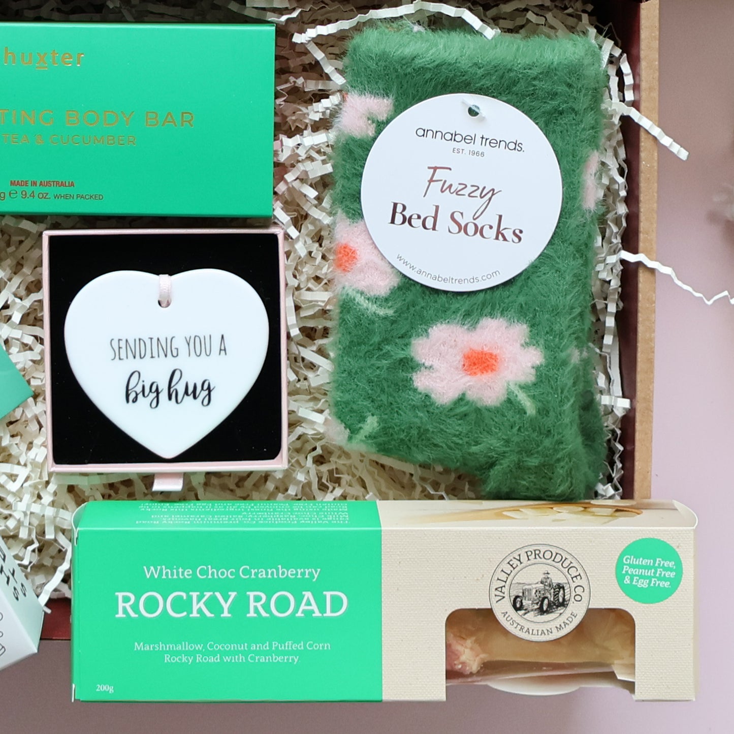 Thinking of you pamper box flat lay showing Huxter body bar bath soak shower steamer keepsake and rocky road Perth