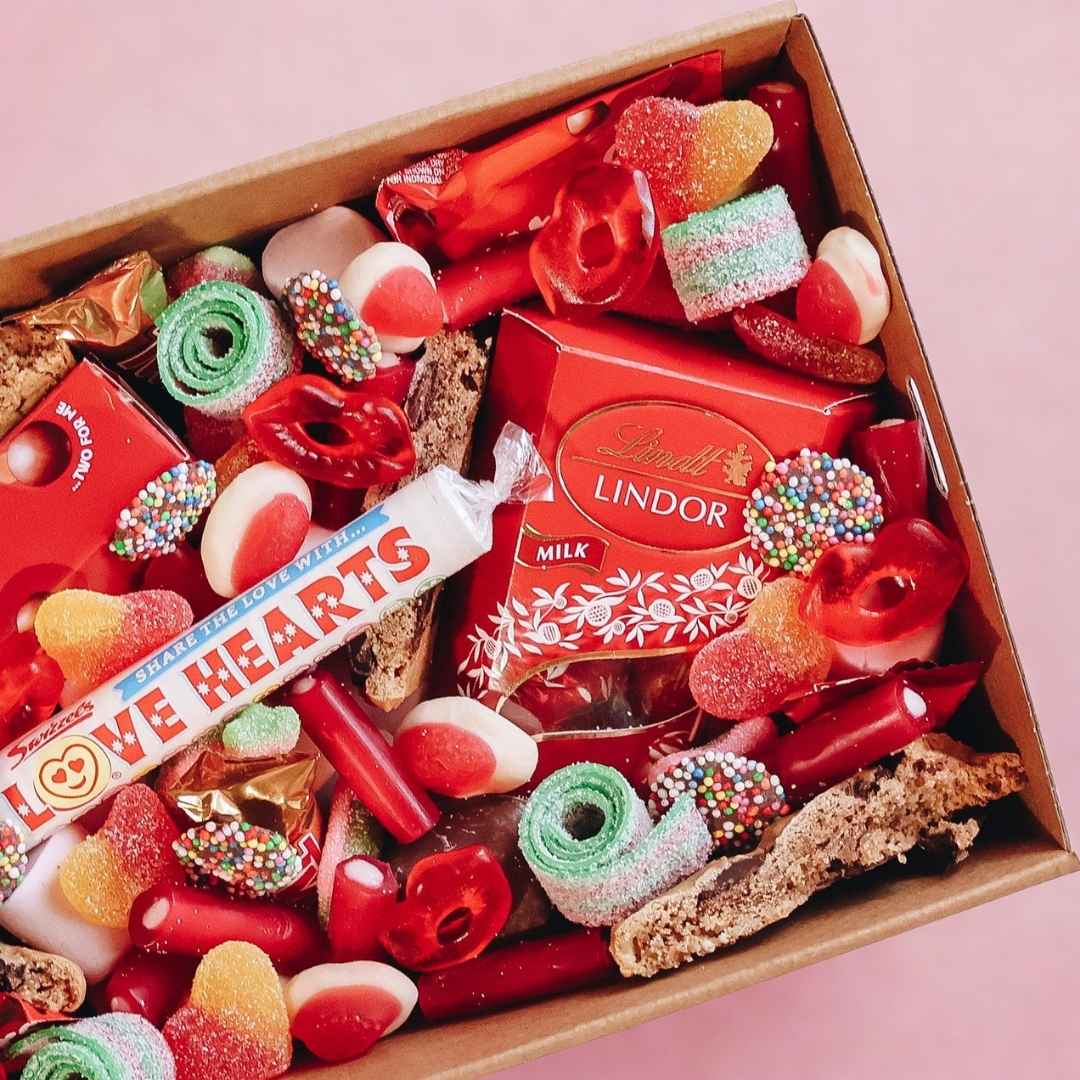 Gift hamper filled with chocolate and lollies.