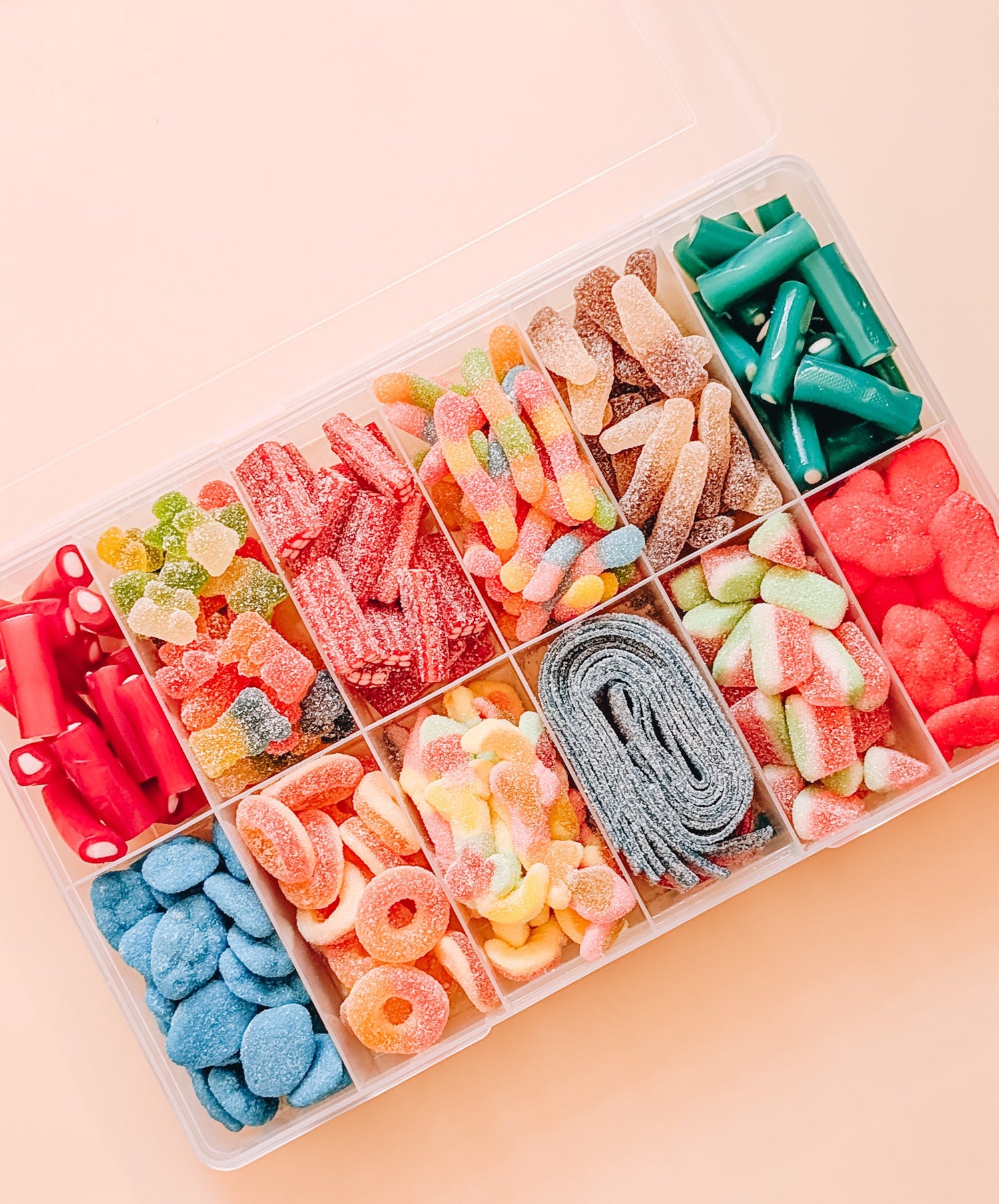 Lolly gift box with 12 compartments, each filled with colourful assorted lollies, perfect for gifting.