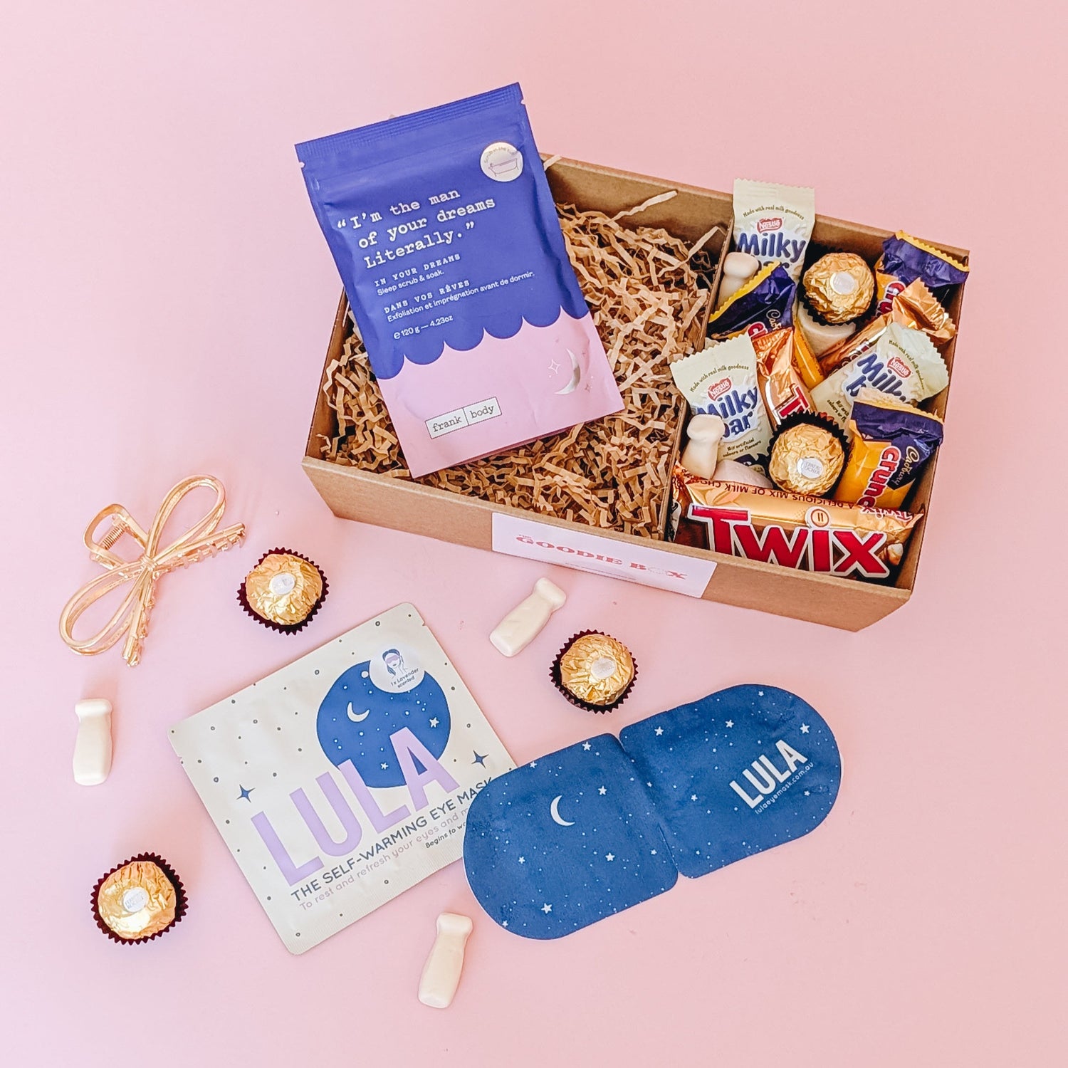 pamper hamper gift box filled with chocolate and lollies, paired with eye maks, and bath soak.