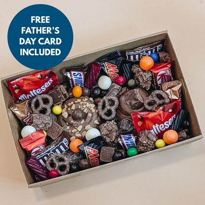 Box of assorted candy with a free Father's Day card included on a beige background