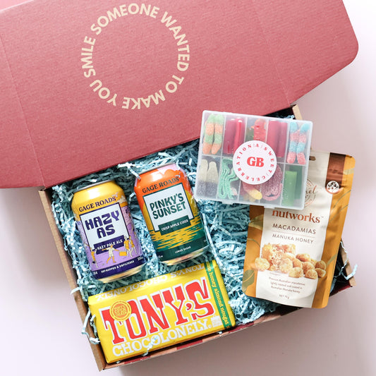 Birthday beers gift box for him open showing Gage Roads Hazy As and Pinkys Sunset Tony's Chocolonely Nutworks macadamias and mini lolly box in branded red box Perth