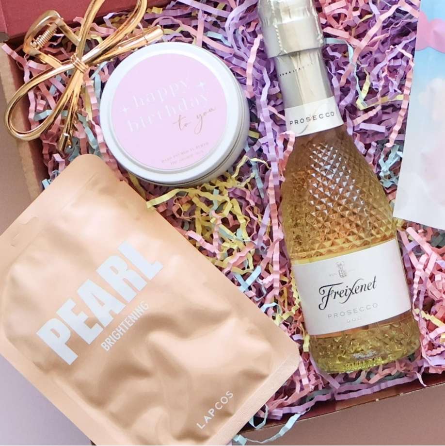 Birthday Bubbles Gift Box close up showing Freixenet prosecco Lapcos Pearl face mask birthday candle and gold hair clip Perth