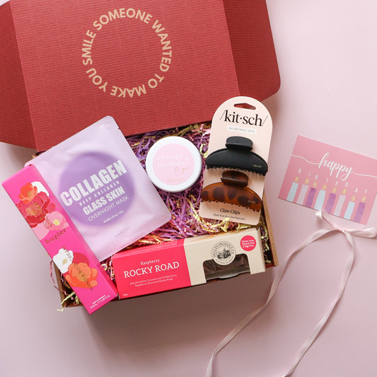 Birthday gift box for her with Happy Birthday candle, rocky road, hand cream, claw clips, face mask 