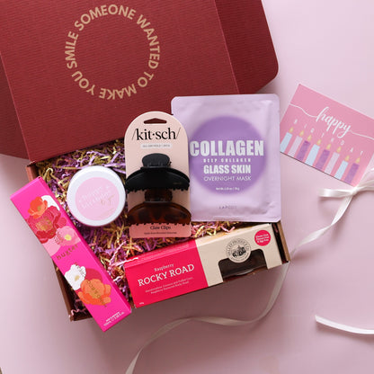 Birthday gift box for her with Happy Birthday candle, rocky road, hand cream, claw clips, face mask 