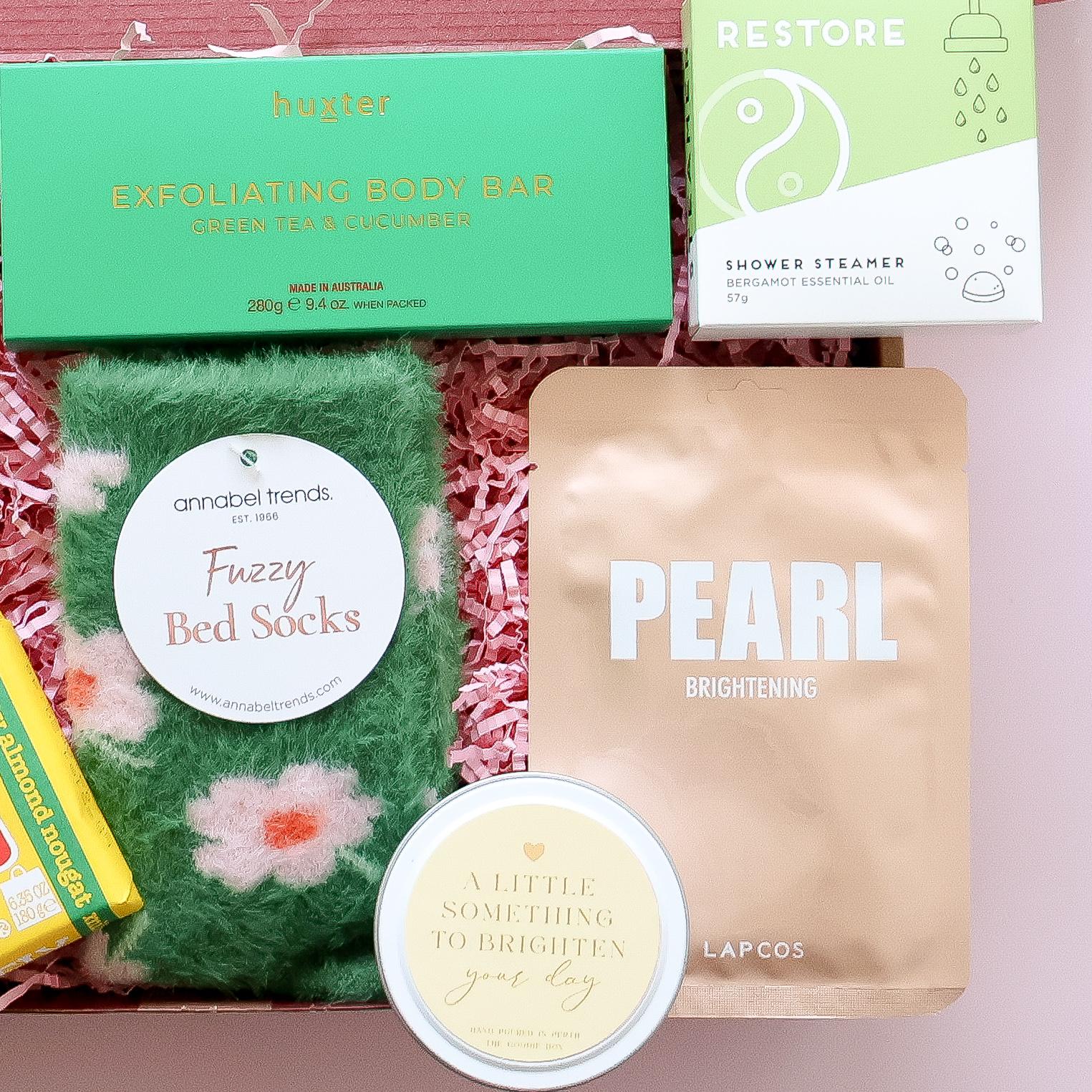 Pamper gift box Perth with Huxter body bar shower steamer fuzzy bed socks Lapcos face mask and candle