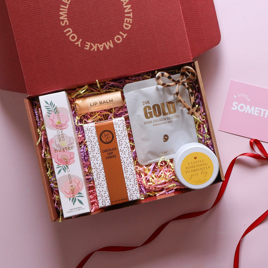 Brighten your day pamper hamper with Huxter orange blossom hand cream, lip balm and chocolate chip cookies
