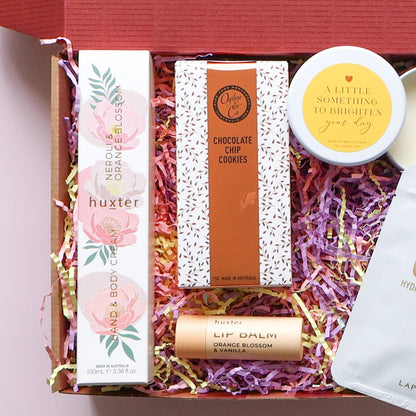 Brighten your day pamper hamper with hand cream, lip balm, cookies