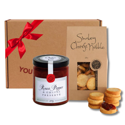 Mini Preserve & Nibbles Gift Box with Ogilvie & Co roast pepper and chilli preserve and smokey cheese nibbles in a kraft gift box with red ribbon
