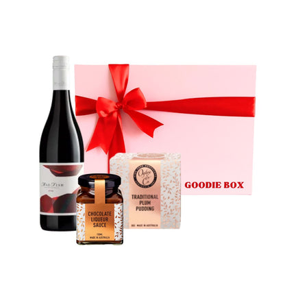 Wine & Festive Treats Gift Hamper with Madfish Shiraz, Ogilvie & Co plum pudding and chocolate liqueur sauce in a pink gift box with red ribbon