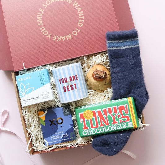 Cosy Night In mens gift hamper Perth with shower steamer, mug, XO Tea, Tony's Chocolonely chocolate, loaded cookie and bed socks