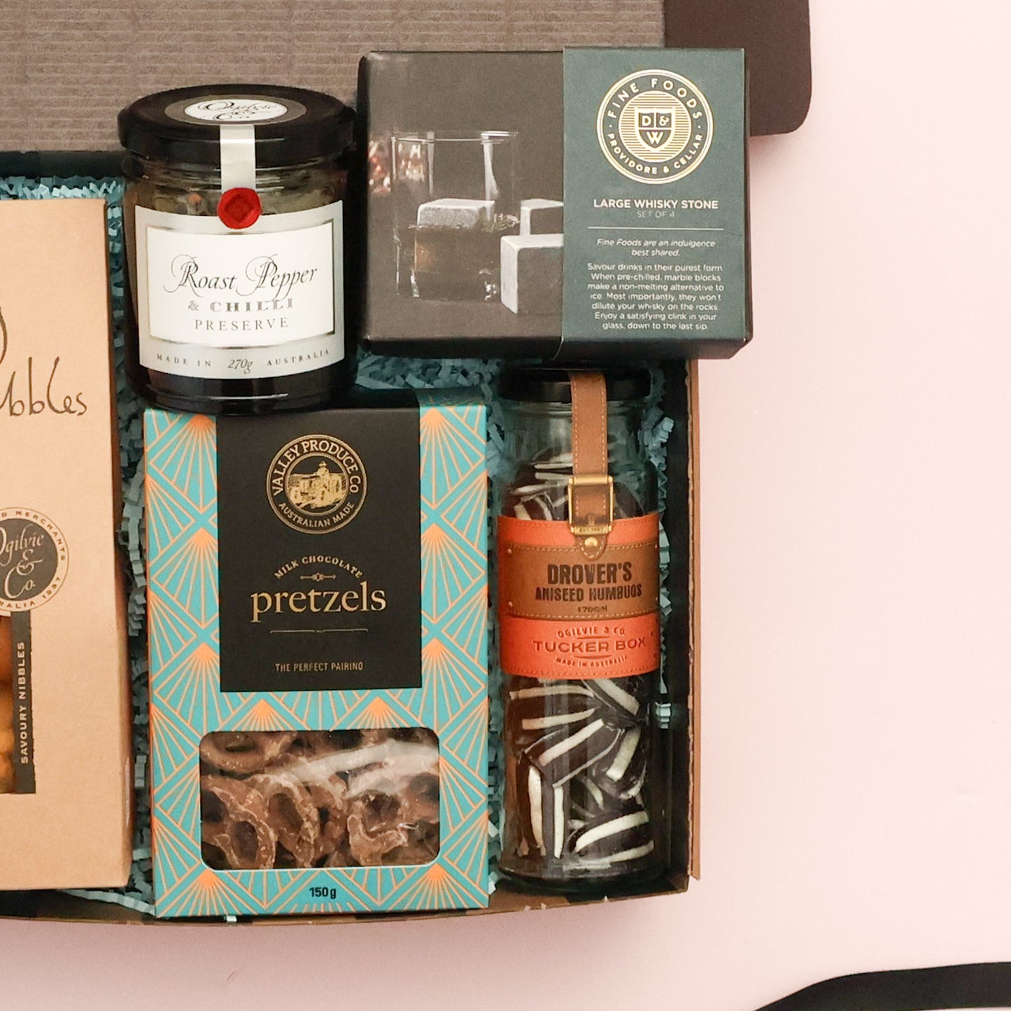 Roast pepper and chilli preserve, whisky stones and chocolate pretzels in a Father's Day gourmet gift box
