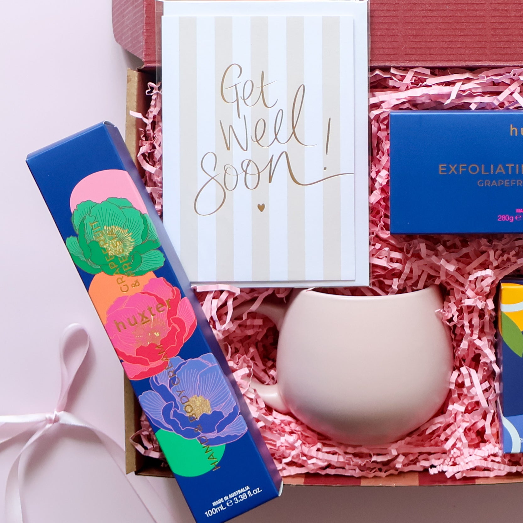 Get well soon gift box showing Huxter grapefruit body bar XO Tea organic breakfast tea and pink tulip mug Perth