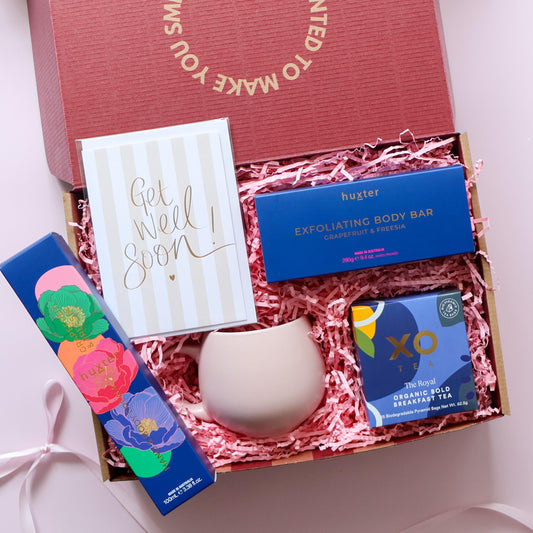 Take a Moment get well soon gift box Perth open showing Huxter body cream body bar XO Tea pink tulip mug and Get Well Soon greeting card