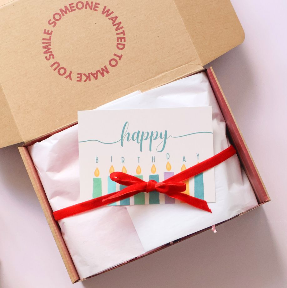 The Goodie Box gift box wrapped with red ribbon and happy birthday card ready for same day delivery Perth