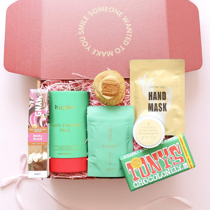 Pamper hamper for her with Huxter body pamper trio, bath soak, hand mask, candle, hot chocolate spoon, chocolate and Biscoff cookie