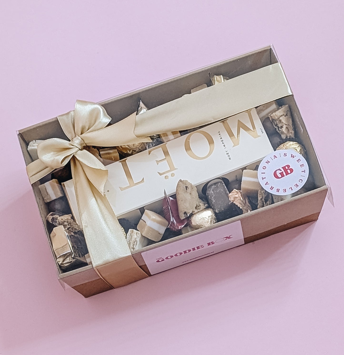 Luxury Moët Champagne and chocolate gift hamper with Bouchee, Ferrero Rocher, Lindt, Whittiker chocolates. Wrapped with a beautiful gold bow ready for gifting. 