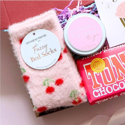Mini happy birthday gift box for her open showing cherry bed socks Tony's Chocolonely birthday candle and happy birthday card in branded red box Perth