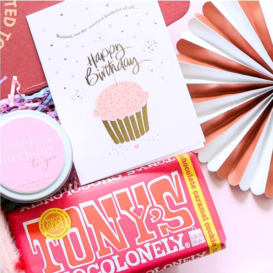 Mini happy birthday gift box for her close up showing Tony's Chocolonely chocolate birthday candle and happy birthday card with rose gold fan decoration Perth
