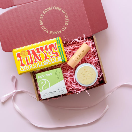Just because gift box showing Tony's Chocolonely Huxter lip balm shower steamer and Brighten Your Day candle Perth