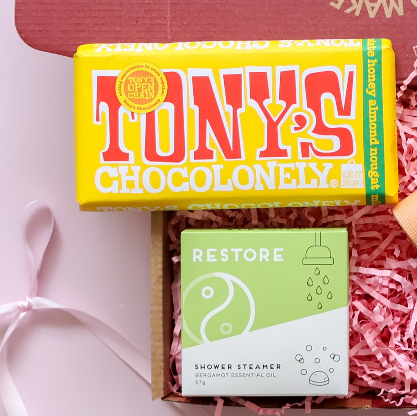 Just because gift box detail showing Tony's Chocolonely honey almond nougat and Restore bergamot shower steamer Perth