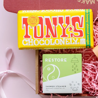 Just because gift box detail showing Tony's Chocolonely honey almond nougat and Restore bergamot shower steamer Perth