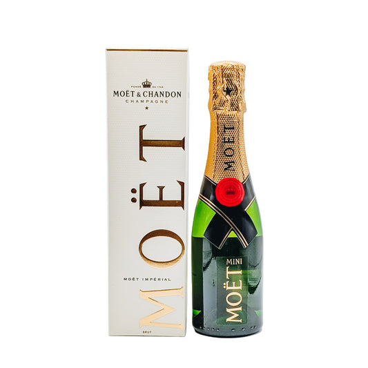 Moét & Chandon champagne bottle with packaging on a white background