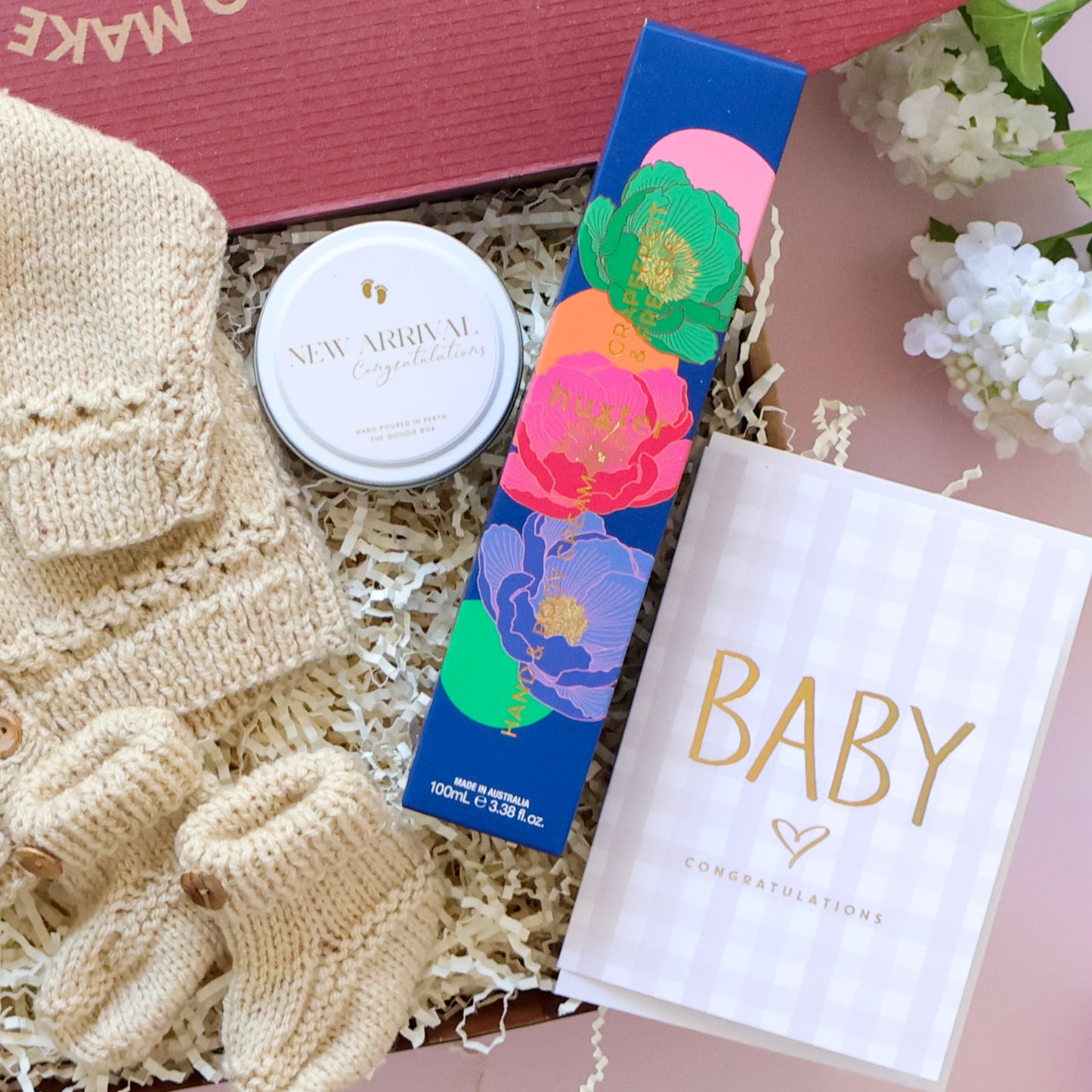 Hand Knitted New Baby Boy Gift Box with knitted booties, New Arrival candle, Huxter body cream and Baby Congratulations card