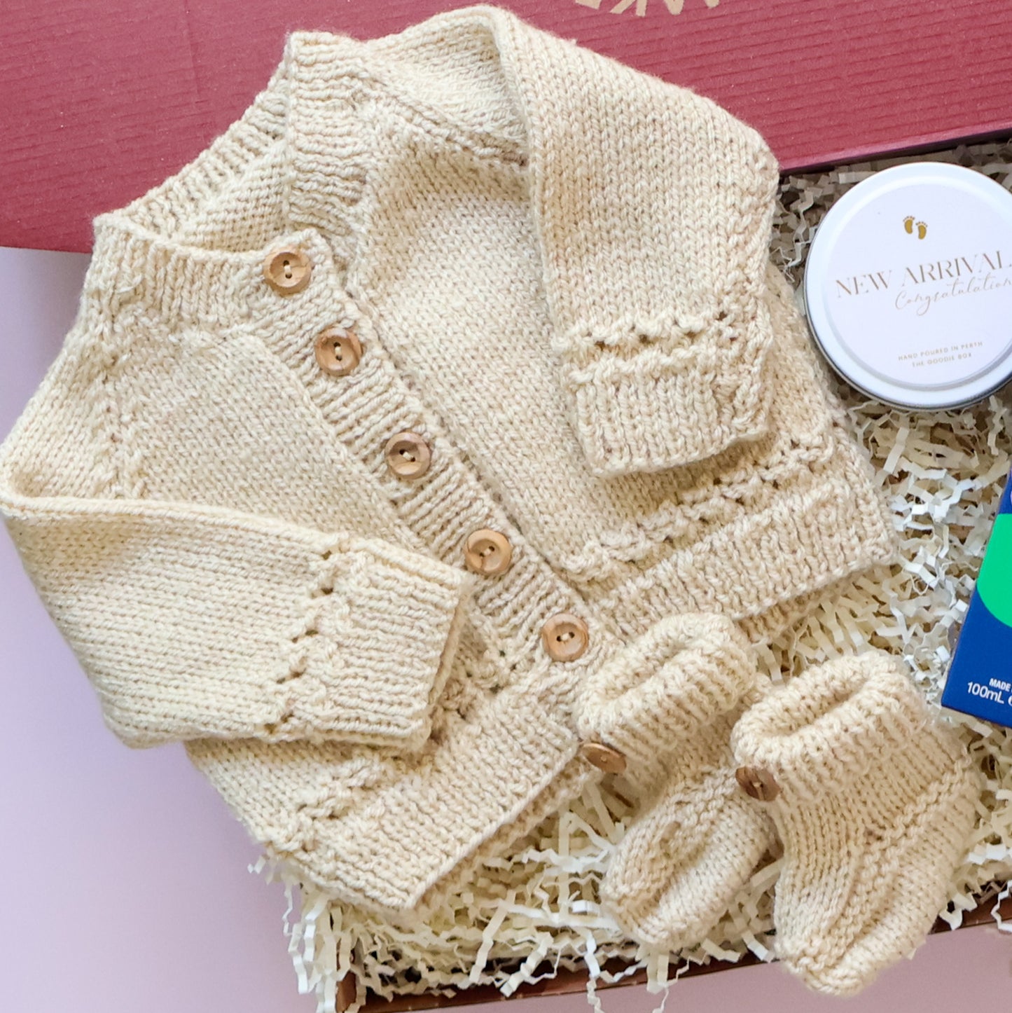 Hand Knitted New Baby Boy Gift Box featuring Scottish knitted cardigan, booties and New Arrival soy candle