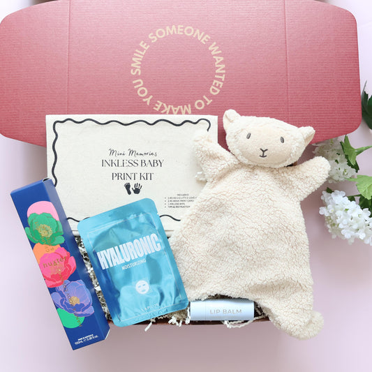 New baby boy gift box with lamb comforter, inkless print kit, Huxter body cream, Hyaluronic face mask and lip balm