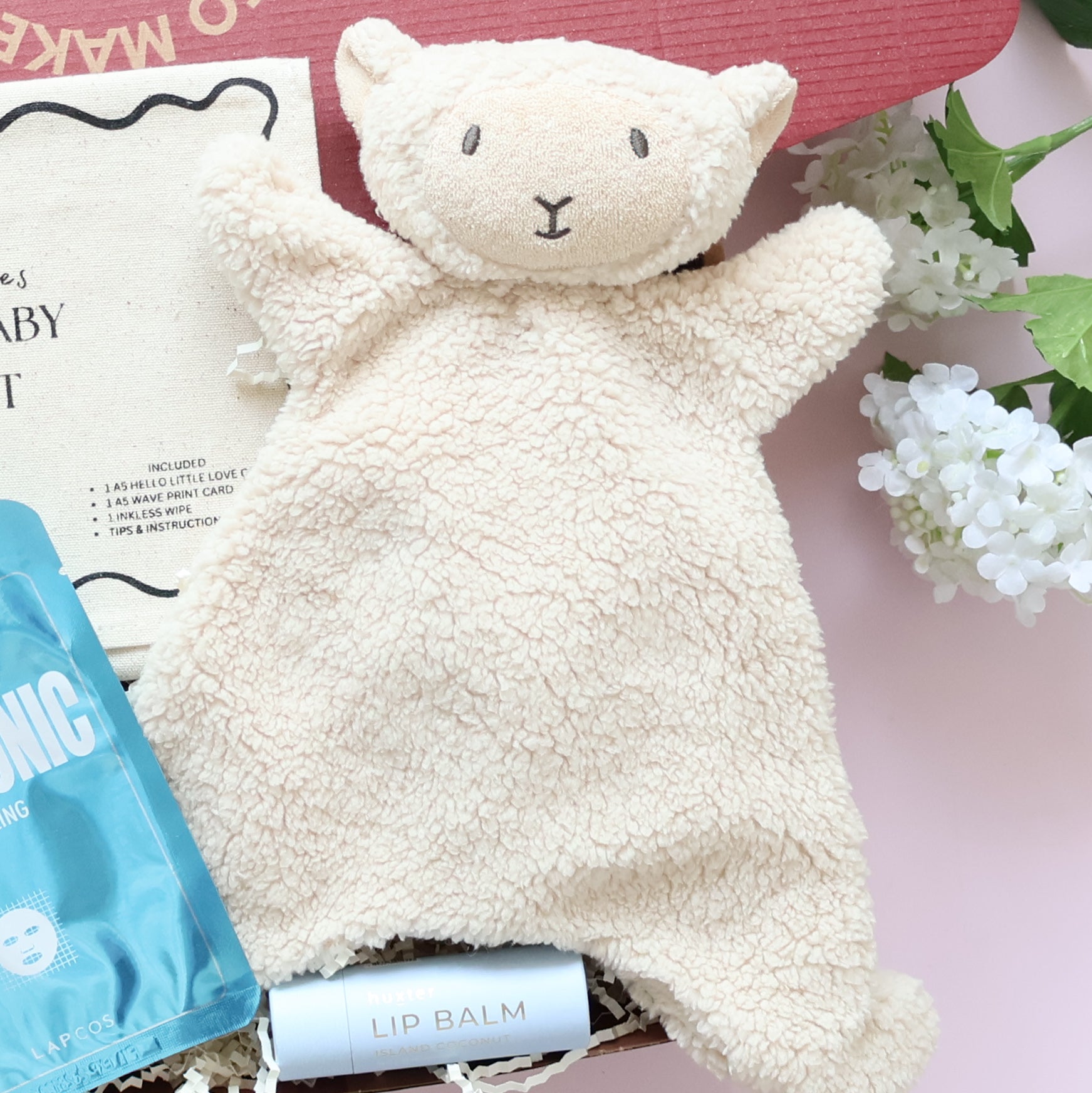New baby boy gift box featuring lamb comforter, Lapcos Hyaluronic K-beauty face mask and lip balm