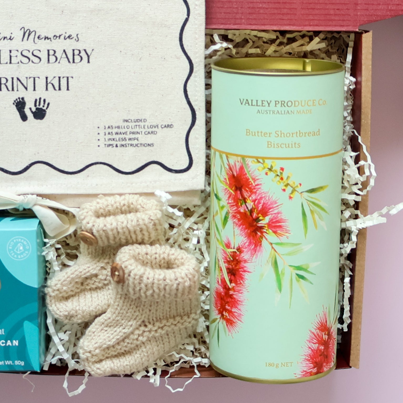 Mum and bub gift box featuring Scottish hand knitted baby booties and Valley Produce butter shortbread biscuits