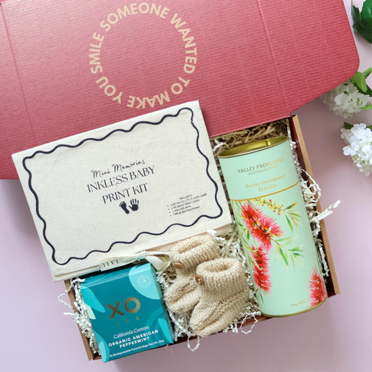 Mum and bub gift box with hand knitted booties, inkless print kit, XO Tea and Valley Produce shortbread