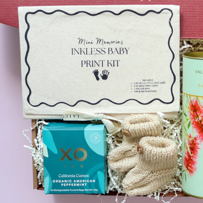 Mum and bub gift box with inkless baby print kit, hand knitted booties and XO Tea