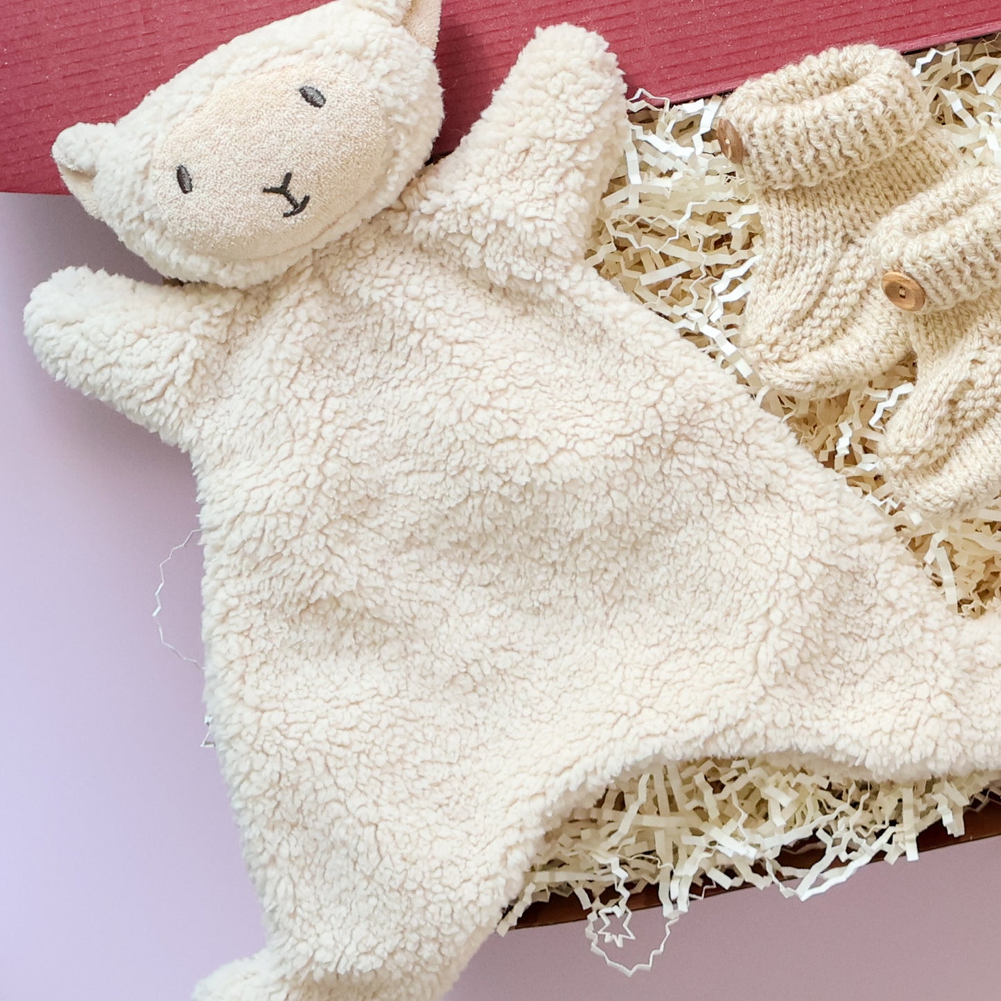 Mini comforter newborn gift box featuring soft lamb comforter and hand knitted booties