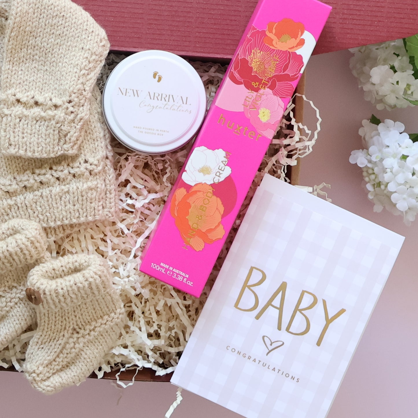 Hand Knitted New Baby Girl Gift Box with knitted booties, New Arrival candle, Huxter body cream and Baby Congratulations card