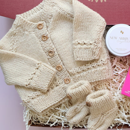 Hand Knitted New Baby Girl Gift Box featuring Scottish knitted cardigan, booties and New Arrival soy candle