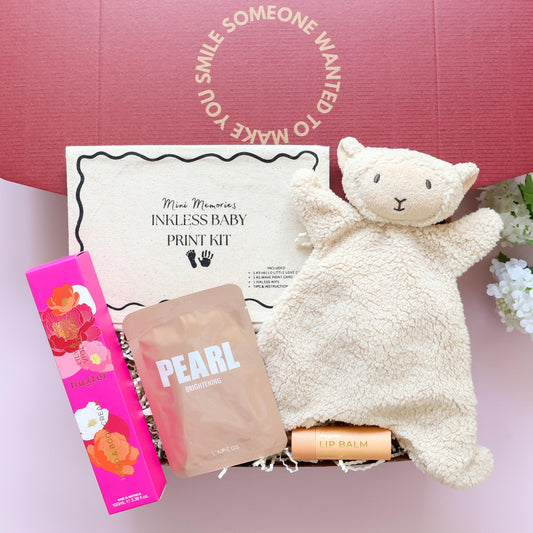 New baby girl gift box with lamb comforter, inkless print kit, Huxter body cream, Pearl face mask and lip balm