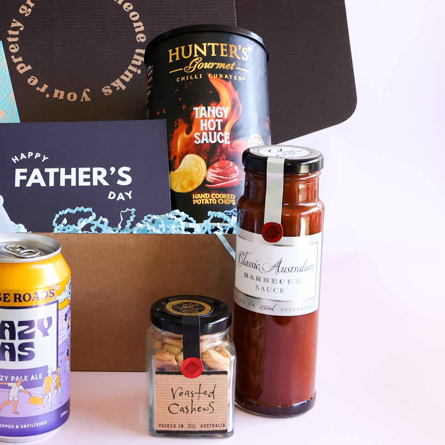 Hunter's hot sauce chips, Australian BBQ sauce and roasted cashews in a Father's Day gift hamper