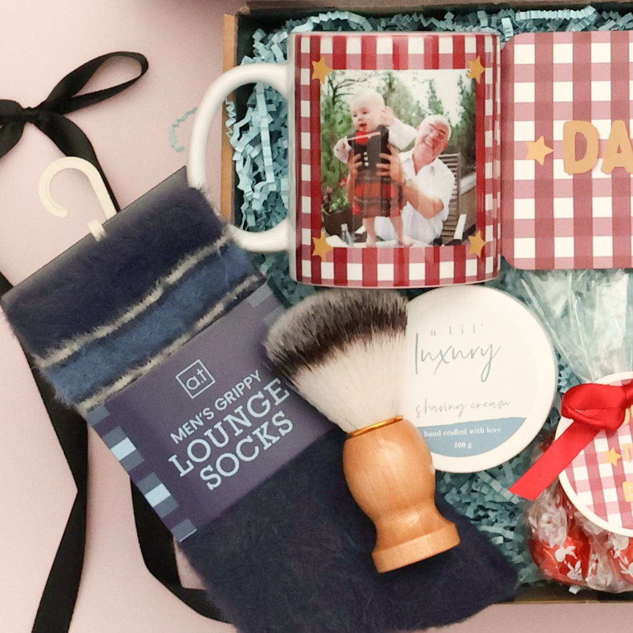 Shaving brush, shaving cream, cosy socks and Lindt chocolates in a Father's Day hamper