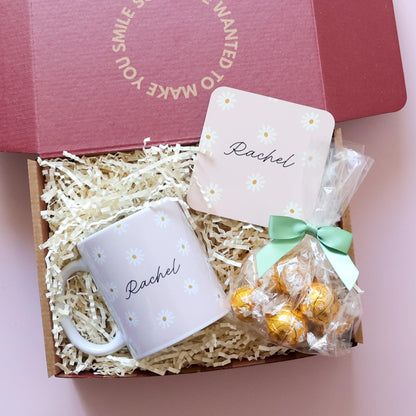 Personalised gift set for her overhead flatlay showing daisy name mug, matching coaster and Lindt Lindor chocolates in open gift box