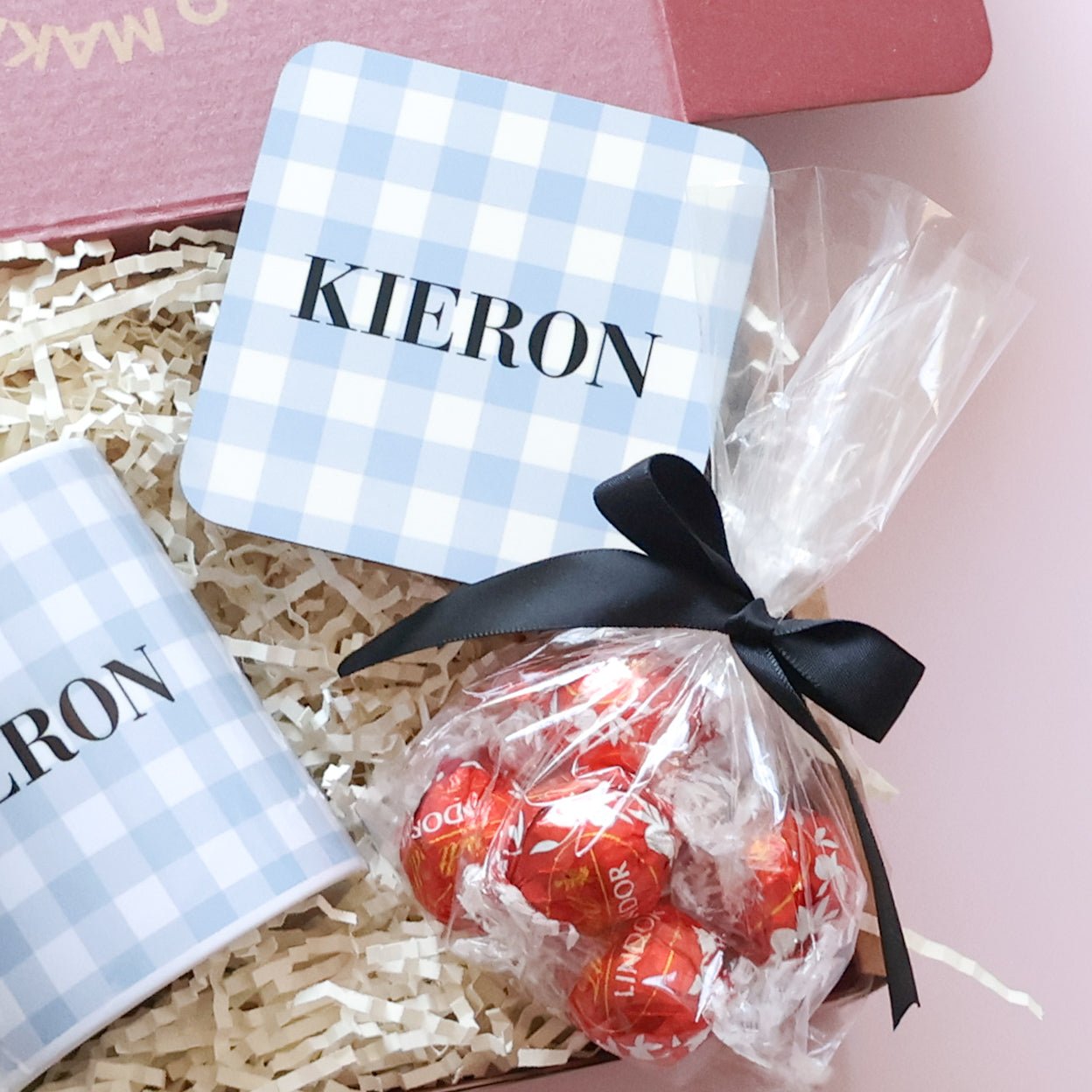 Close up of personalised gingham coaster and Lindt Lindor chocolates in personalised gift set for him