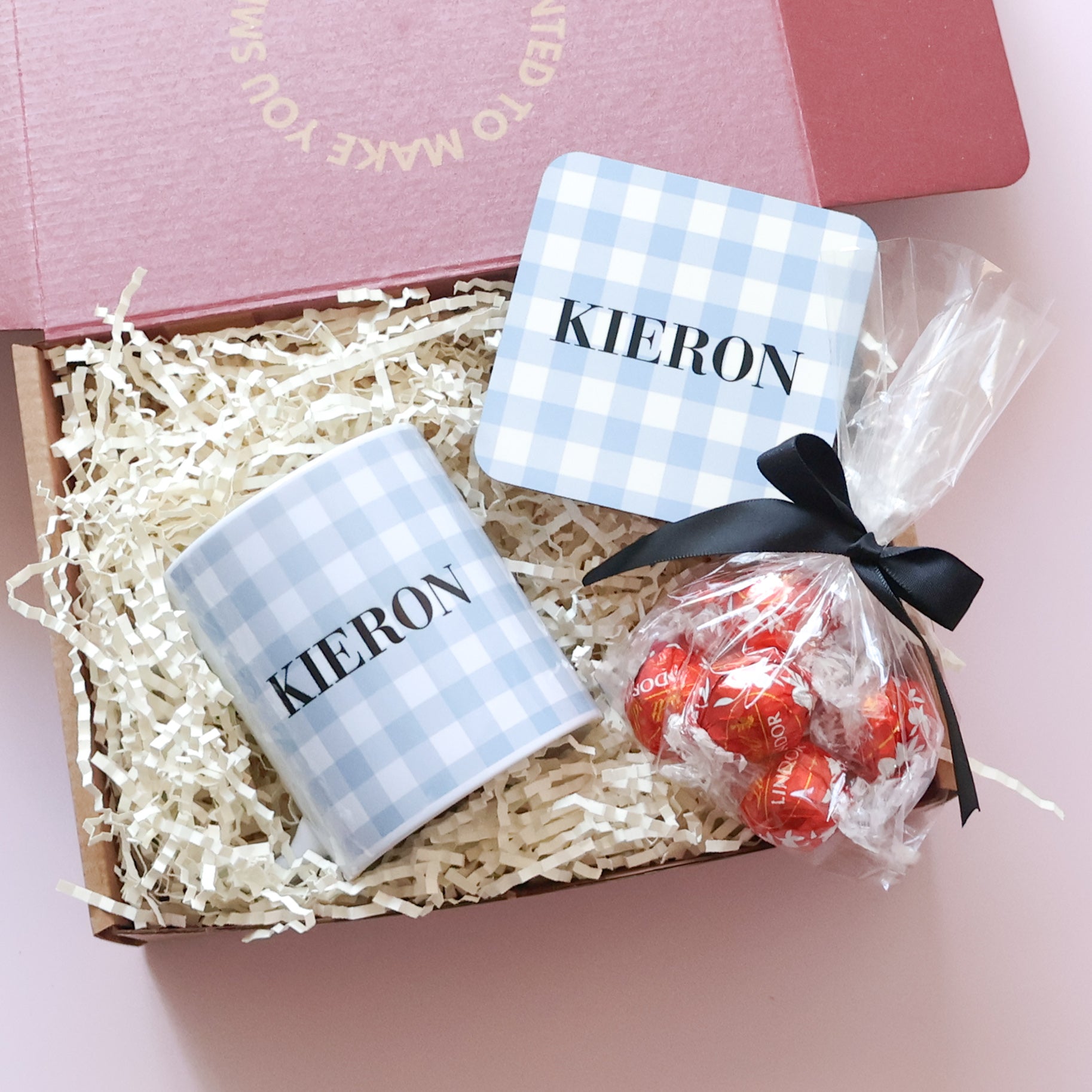 Personalised gift set for him showing custom gingham name mug, matching coaster and Lindt Lindor chocolates in open gift box