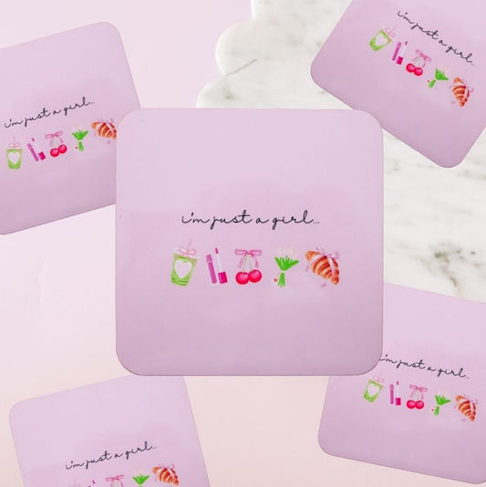 I'm just a girl quote coaster in pink with matcha drink lipstick cherry and croissant icons flatlay on pink background – Goodie Box gift box add-on Perth