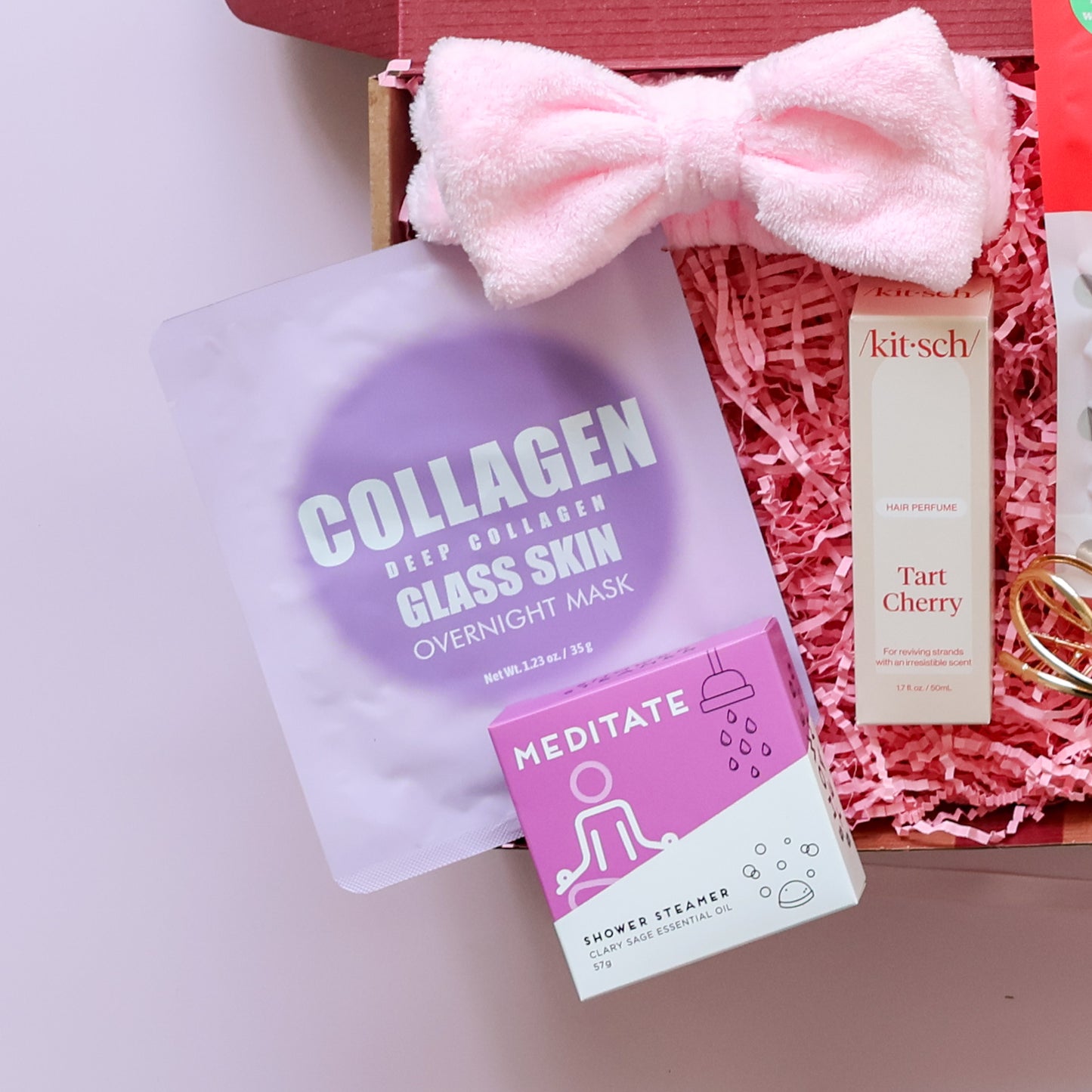 self care gift box Perth with collagen overnight mask, Meditate shower steamer, pink spa headband and Kitsch hair perfume
